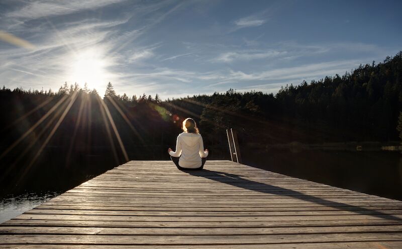 Woman meditating on outside